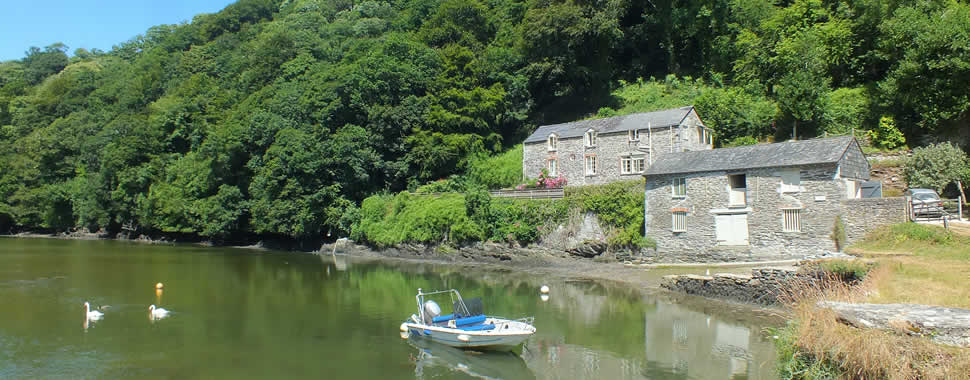 From Bodinnick a footpath runs above Pont Pill creek to a footbridge over the quiet waters at Pont (pictured above) and then on to Polruan.