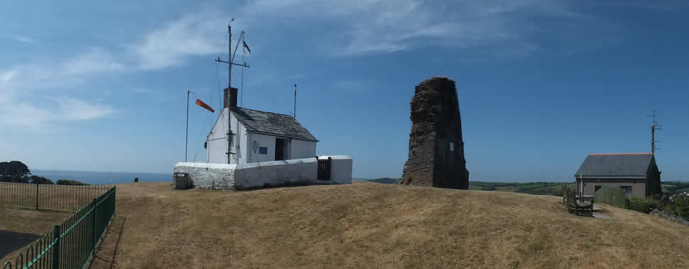 The NCI Polruan Lookout Station alongside St Saviours Chapel ruins stand on the hill high above Polruan